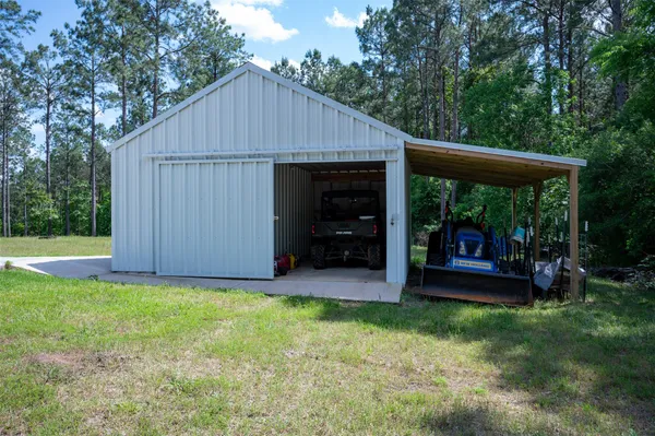 a view of a park with large trees