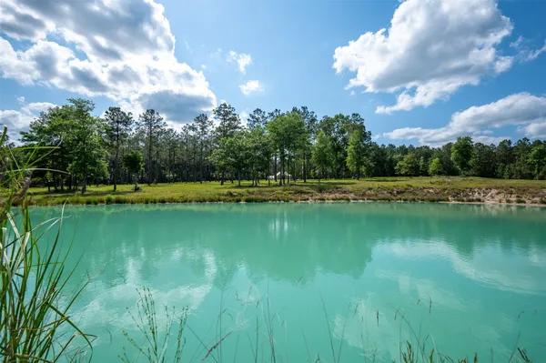 a view of a lake in between the house