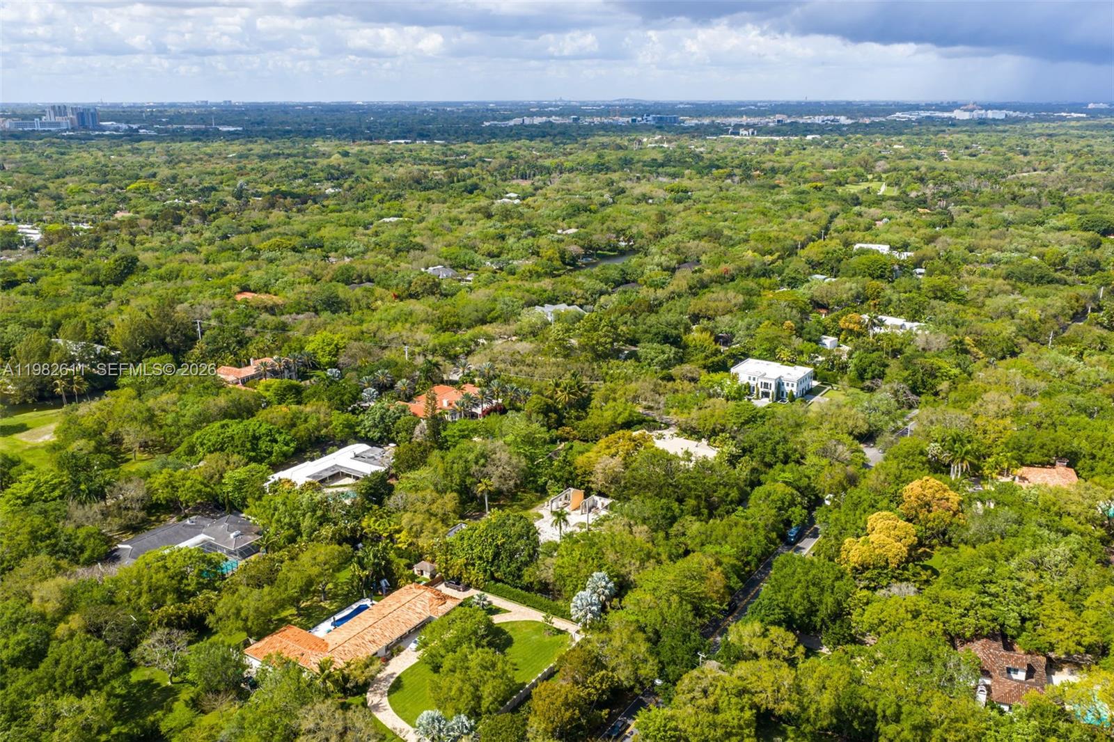 10550 Old Cutler Road Coral Gables, FL 33156 - Photo 14 of 24 a view of a yard with an outdoor space