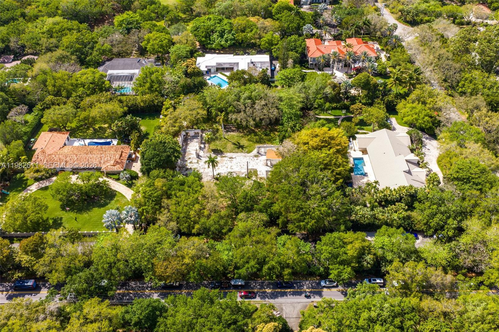 10550 Old Cutler Road Coral Gables, FL 33156 - Photo 18 of 24 an aerial view of residential houses with outdoor space and trees