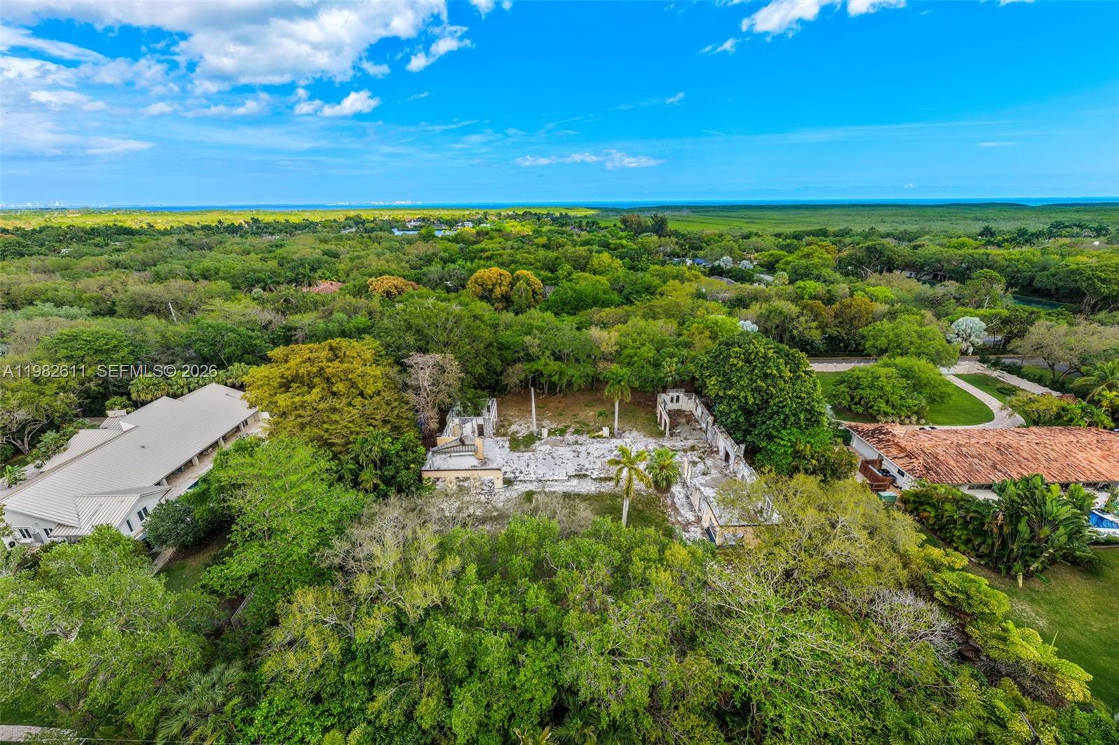 10550 Old Cutler Road Coral Gables, FL 33156 - Photo 21 of 24 a view of a city with lush green forest