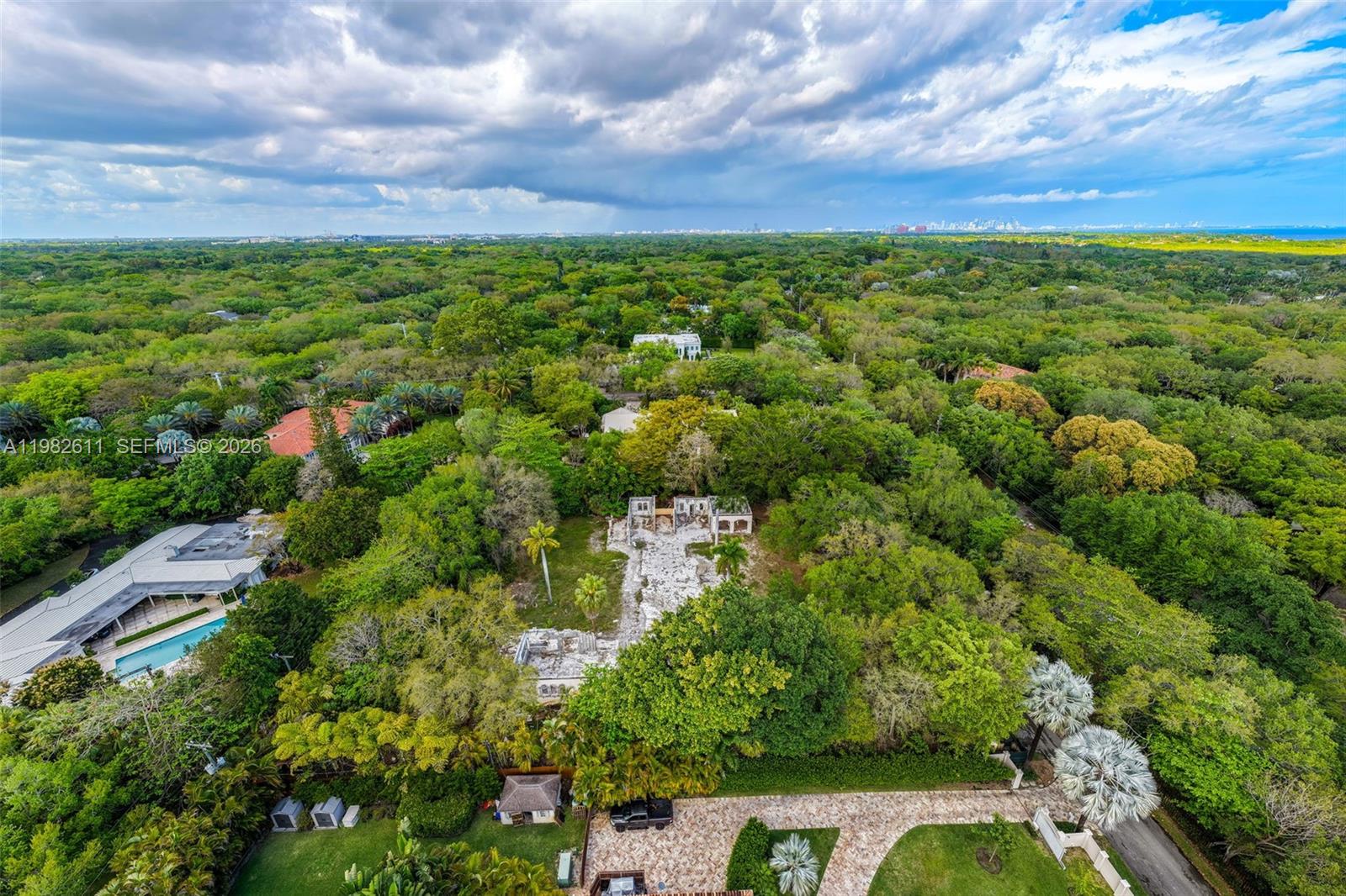 10550 Old Cutler Road Coral Gables, FL 33156 - Photo 22 of 24 a view of a city with lush green forest