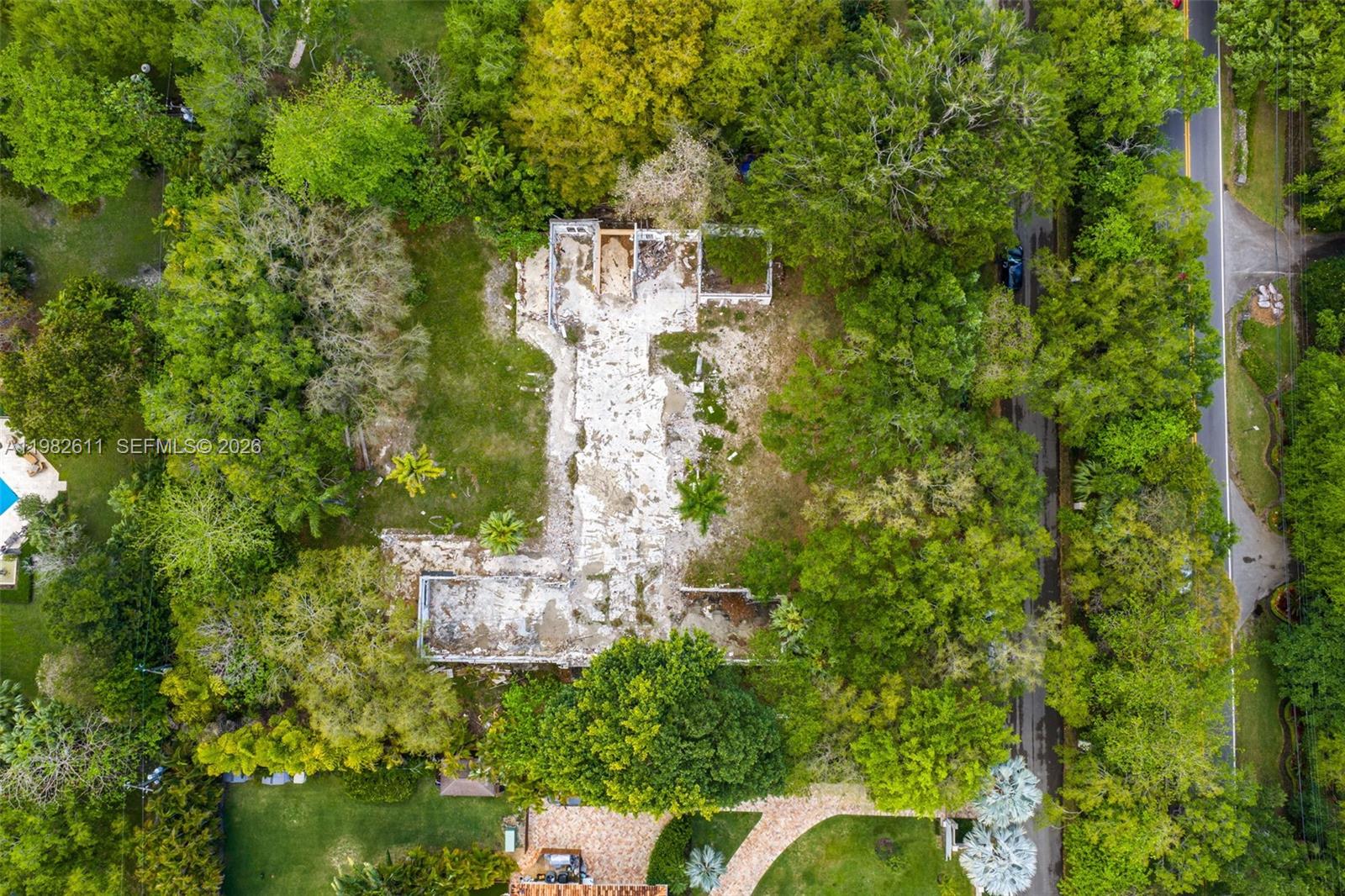 10550 Old Cutler Road Coral Gables, FL 33156 - Photo 23 of 24 an aerial view of residential house with outdoor space and trees all around