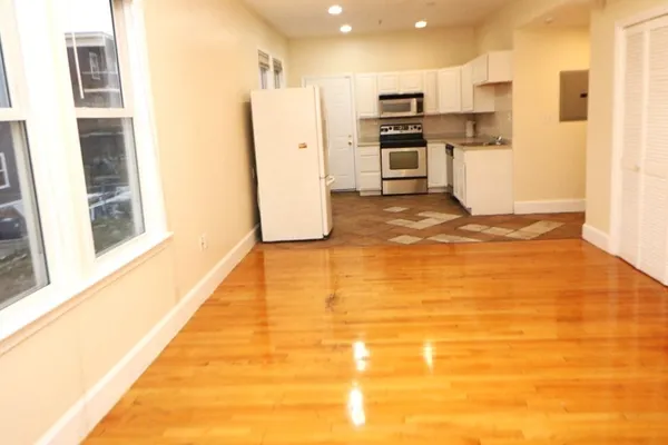 a view of large kitchen with stainless steel appliances