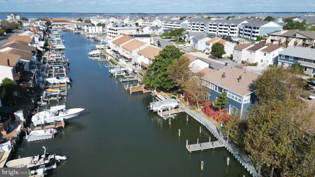 an aerial view of a house with a lake view