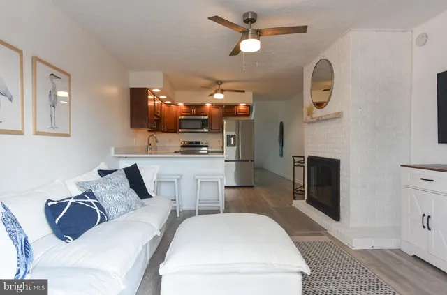 a living room with fireplace furniture and a flat screen tv