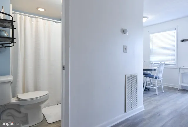 a view of a dining room with furniture and window