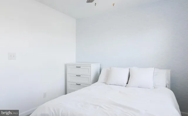 a bedroom with a bed and a shower