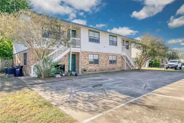 a view of a house with a street