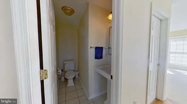 a view of a kitchen with microwave and refrigerator