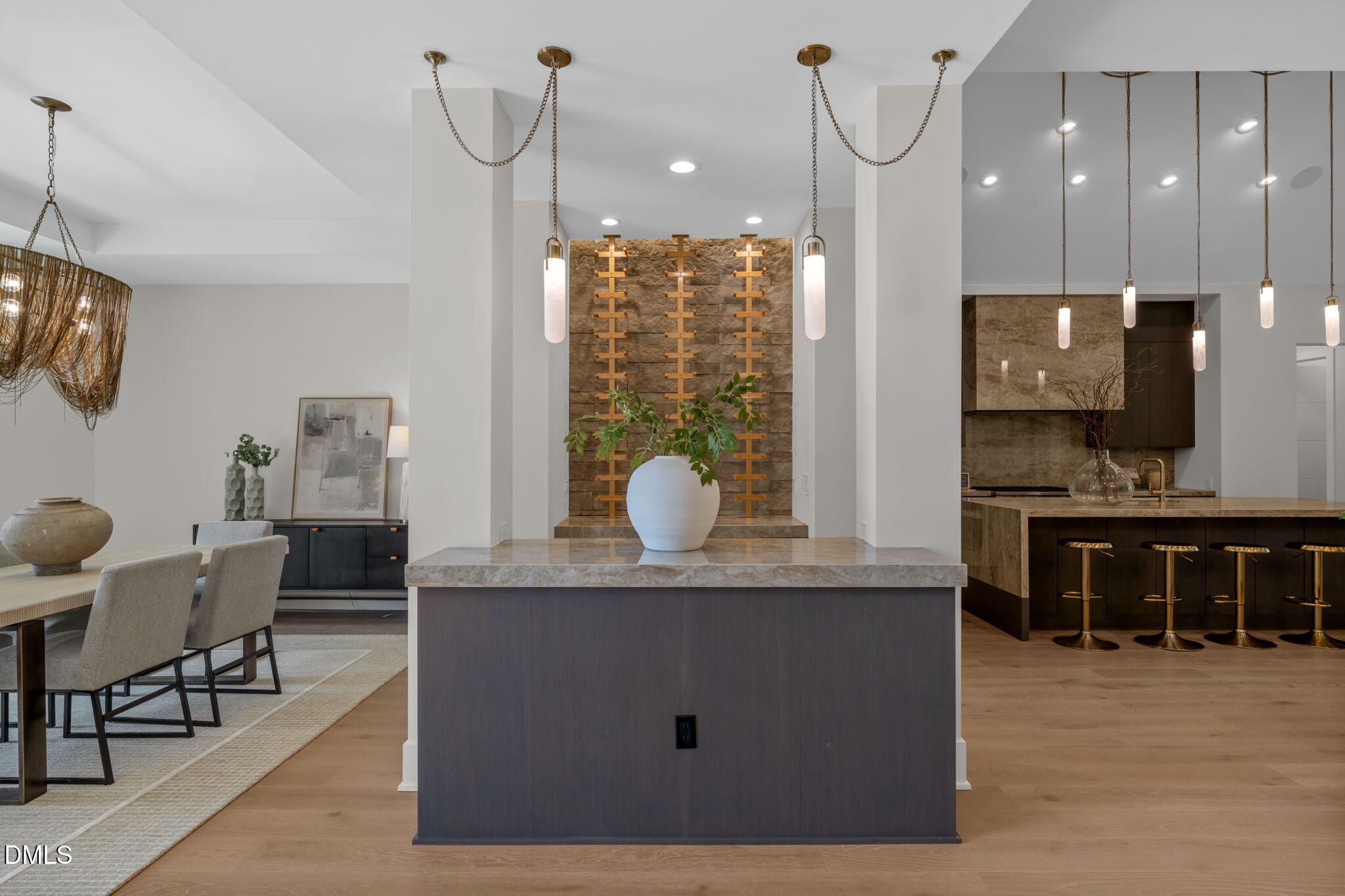 504 Colvard Woods Way Durham, NC 27713 - Photo 15 of 77 a kitchen with kitchen island granite countertop a stove a sink a dining table and chairs with wooden floor