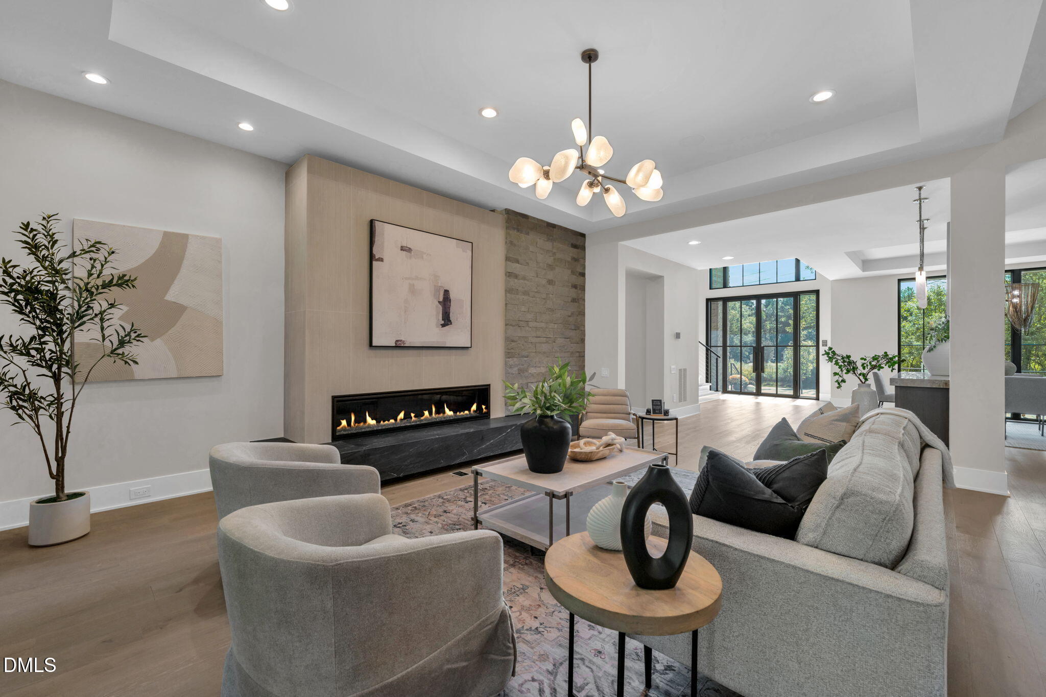 504 Colvard Woods Way Durham, NC 27713 - Photo 21 of 77 a living room with furniture a chandelier and a chandelier