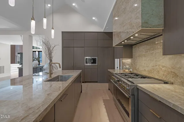 a kitchen with a sink and a refrigerator