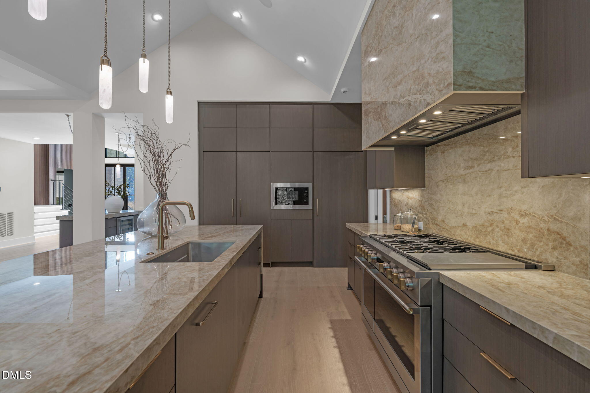 504 Colvard Woods Way Durham, NC 27713 - Photo 25 of 77 a kitchen with stainless steel appliances granite countertop a sink a stove and a wooden floors