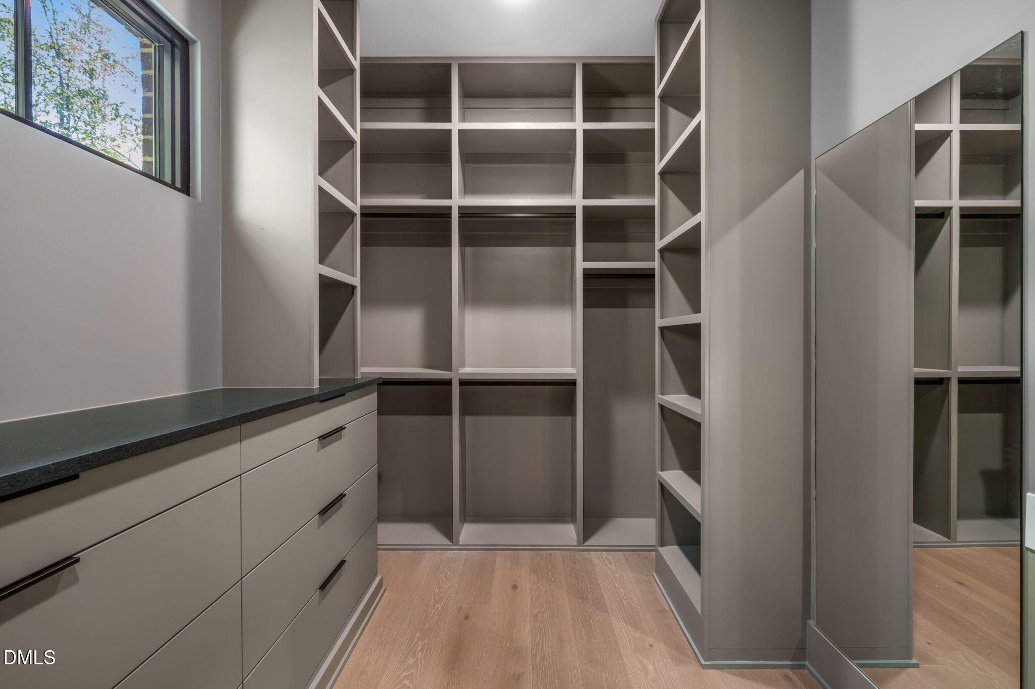 504 Colvard Woods Way Durham, NC 27713 - Photo 46 of 77 a view of walk in closet with empty racks
