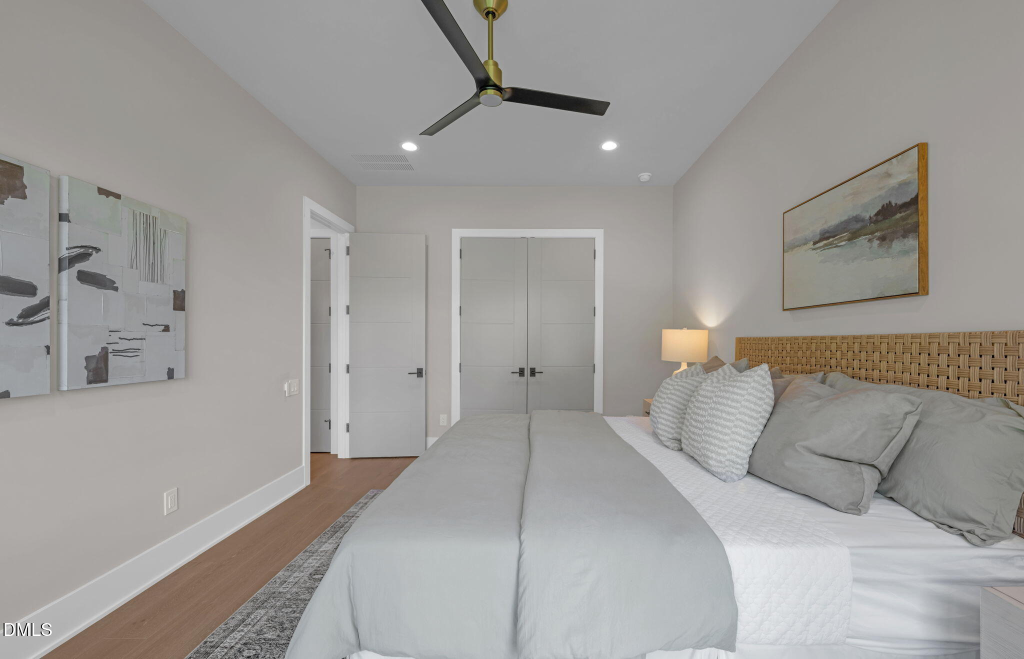 504 Colvard Woods Way Durham, NC 27713 - Photo 48 of 77 a bedroom with a large bed and a painting on the wall