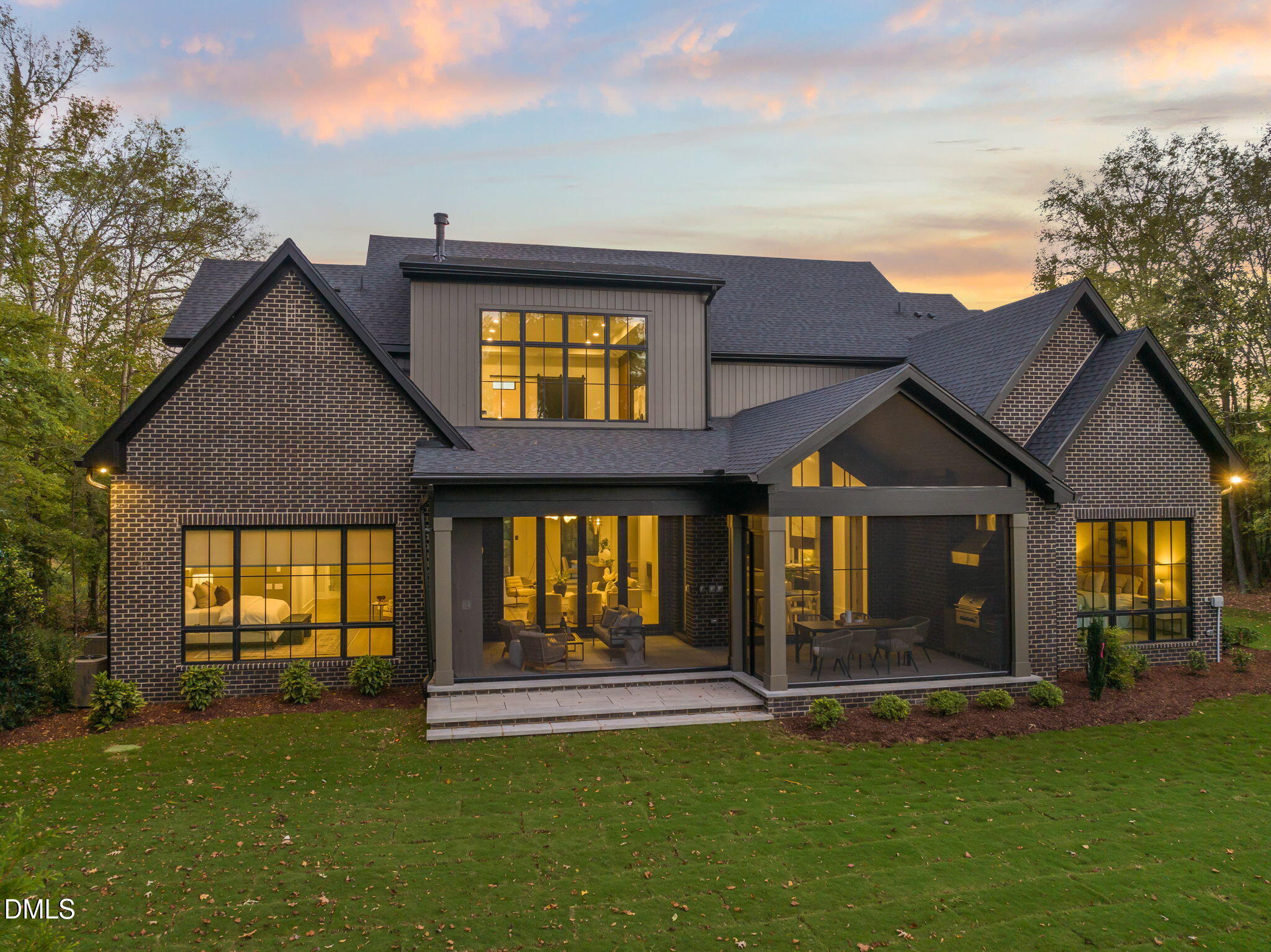 504 Colvard Woods Way Durham, NC 27713 - Photo 5 of 77 a view of a house with floor to ceiling windows and a yard