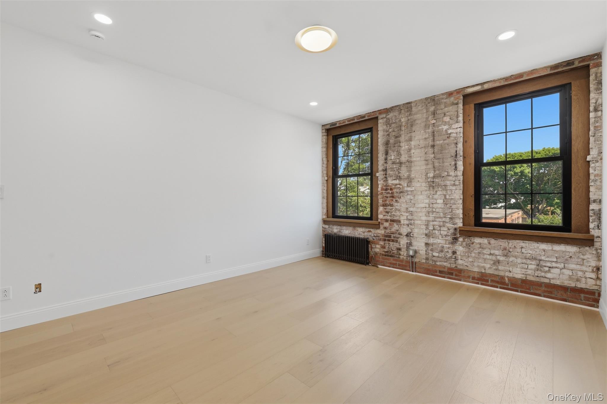207 Main Street, Unit 3 Beacon, NY 12508 - Photo 10 of 23 an empty room with windows