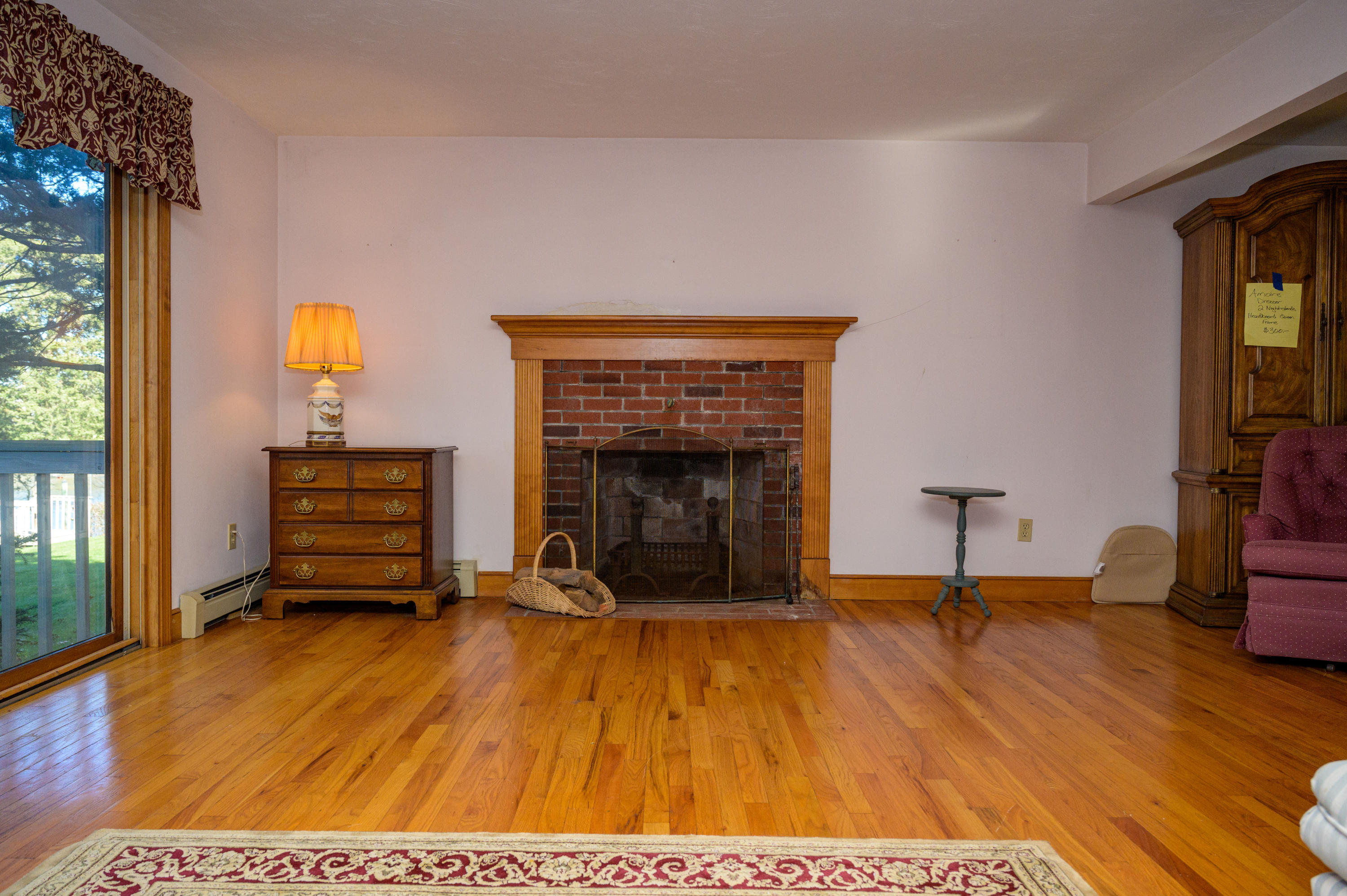 18 Warren Road Bourne, MA 02532 - Photo 11 of 36 a living room with furniture and a fireplace