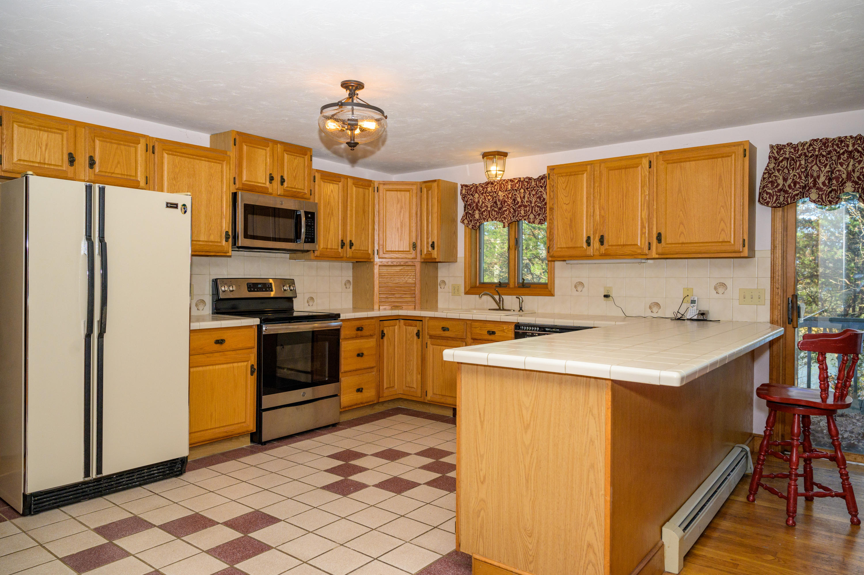 18 Warren Road Bourne, MA 02532 - Photo 13 of 36 a kitchen with a sink appliances and cabinets