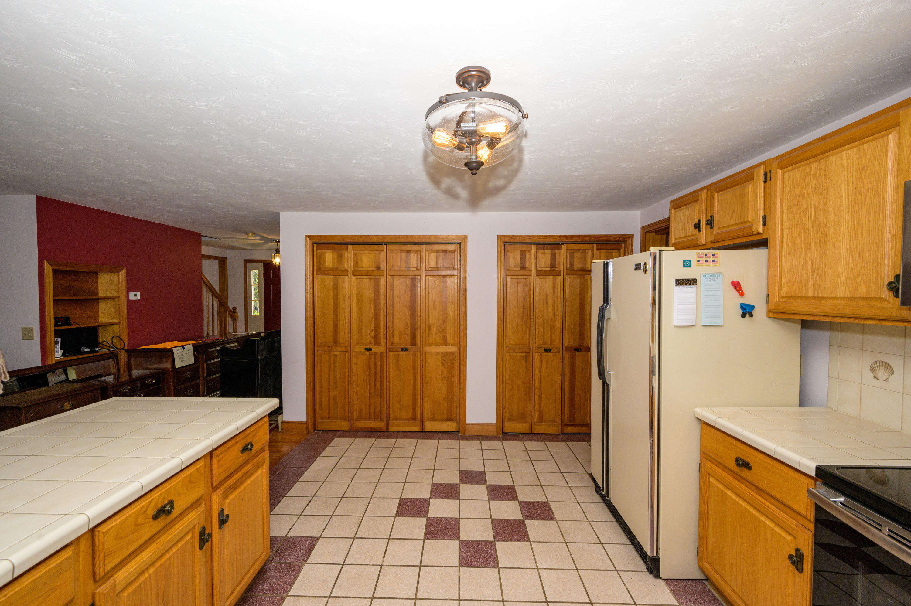 18 Warren Road Bourne, MA 02532 - Photo 15 of 36 a kitchen with stainless steel appliances granite countertop a sink stove and refrigerator
