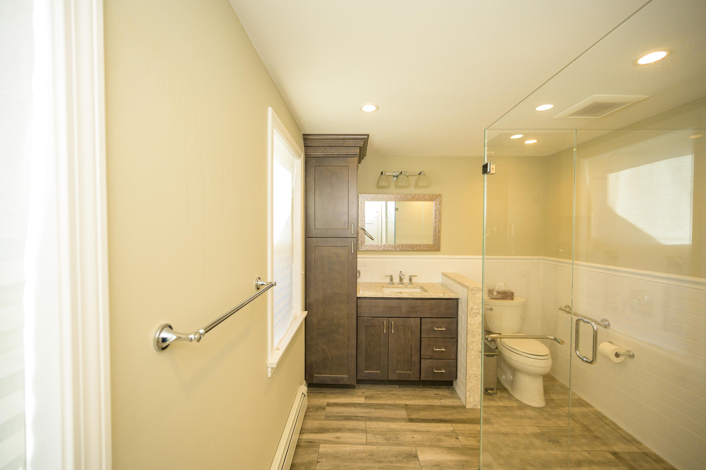 18 Warren Road Bourne, MA 02532 - Photo 20 of 36 a bathroom with a sink a toilet and shower