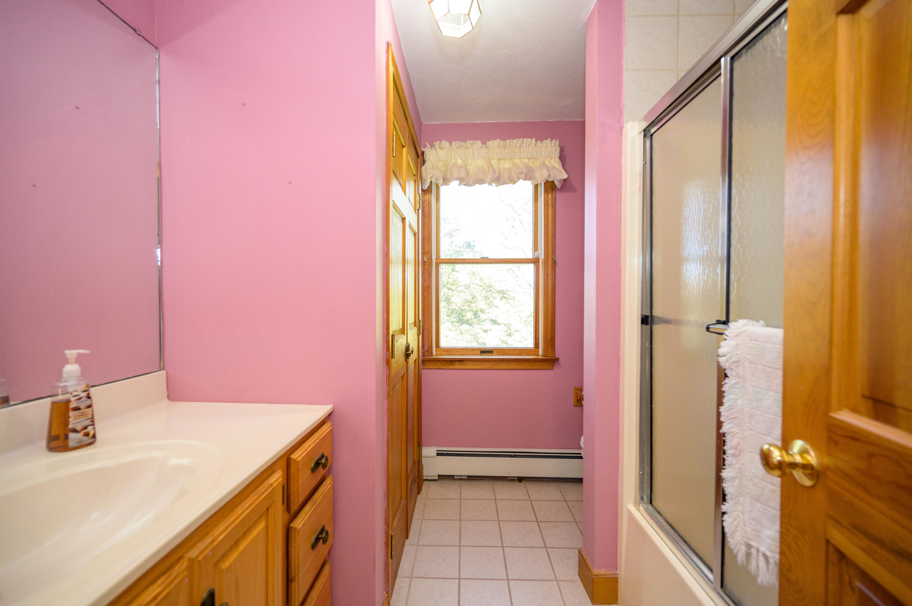 18 Warren Road Bourne, MA 02532 - Photo 27 of 36 a bathroom with a sink a vanity and a mirror