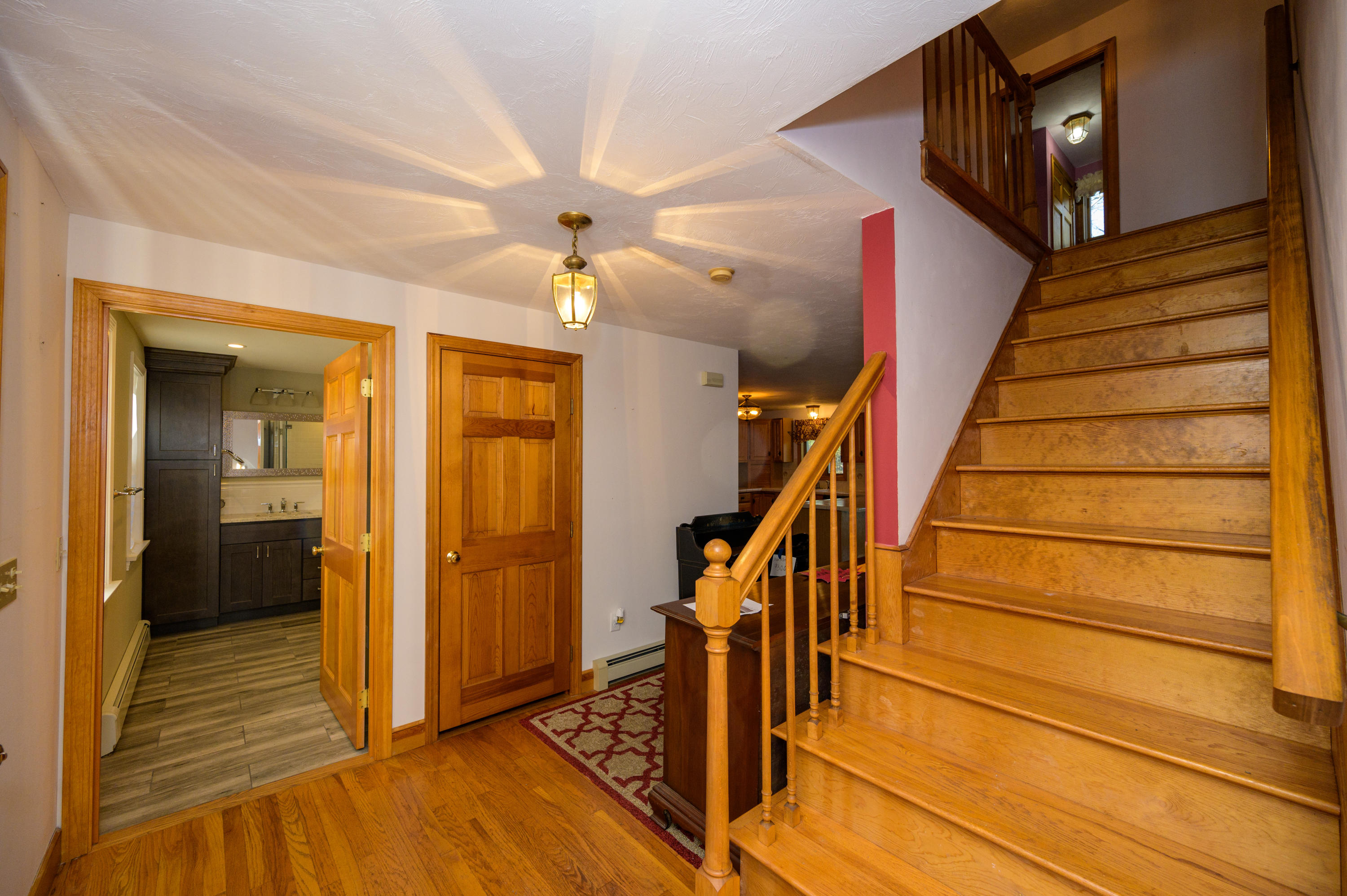 18 Warren Road Bourne, MA 02532 - Photo 28 of 36 a view of a hallway with wooden floor and staircase