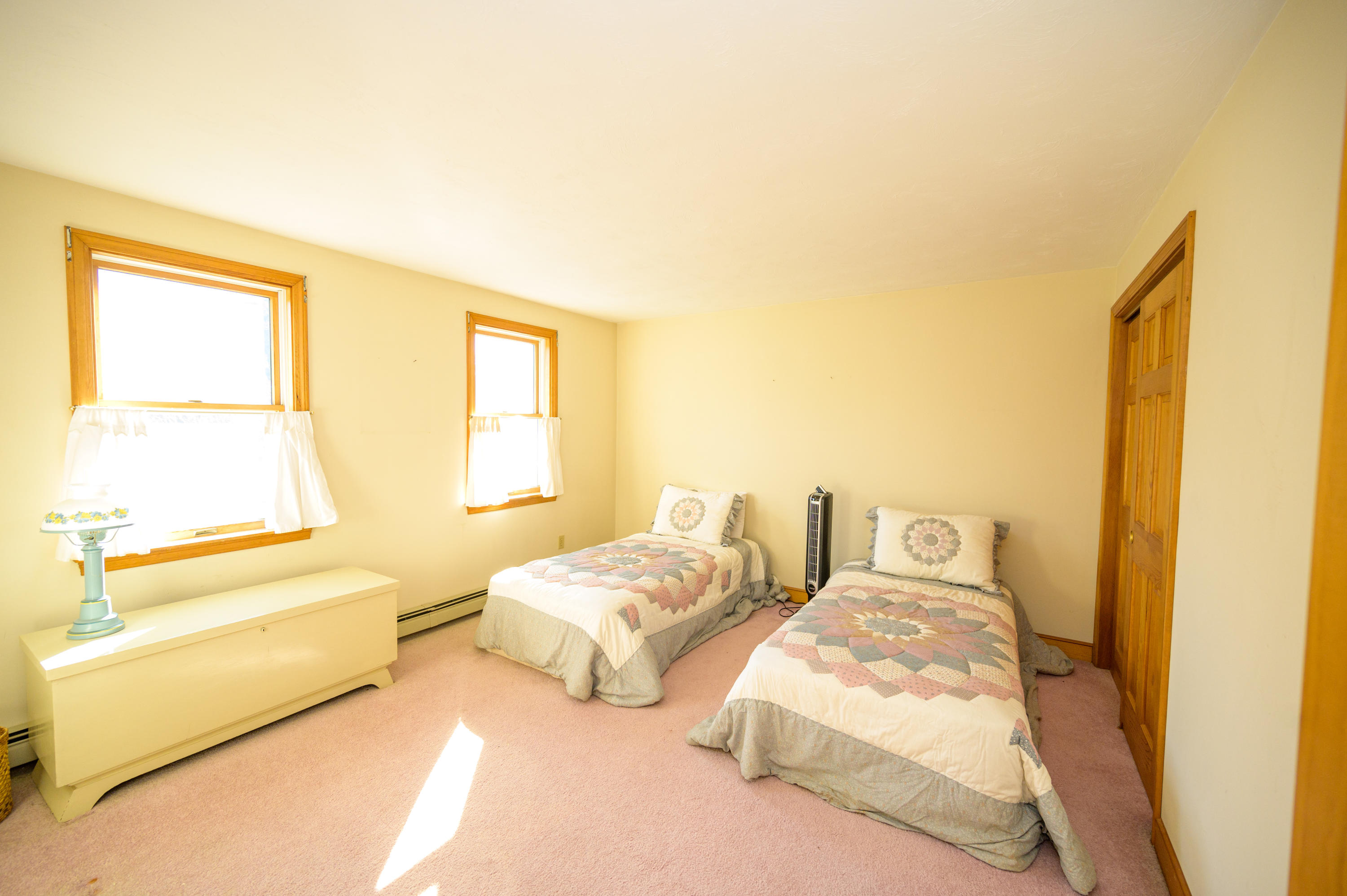 18 Warren Road Bourne, MA 02532 - Photo 31 of 36 a bedroom with two beds and painted walls next to a window