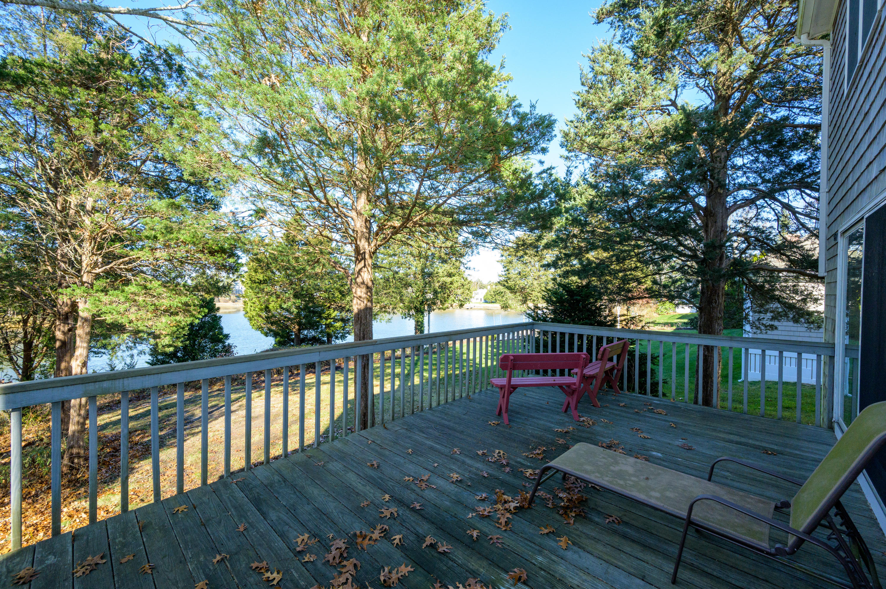 18 Warren Road Bourne, MA 02532 - Photo 32 of 36 a view of a deck with a bench