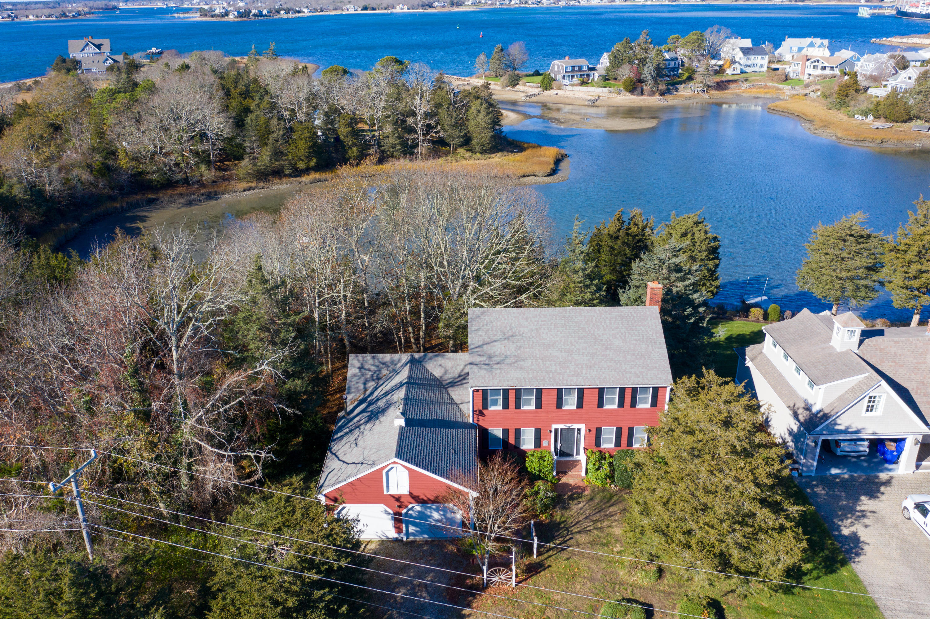18 Warren Road Bourne, MA 02532 - Photo 4 of 36 an aerial view of a house with swimming pool and lake view