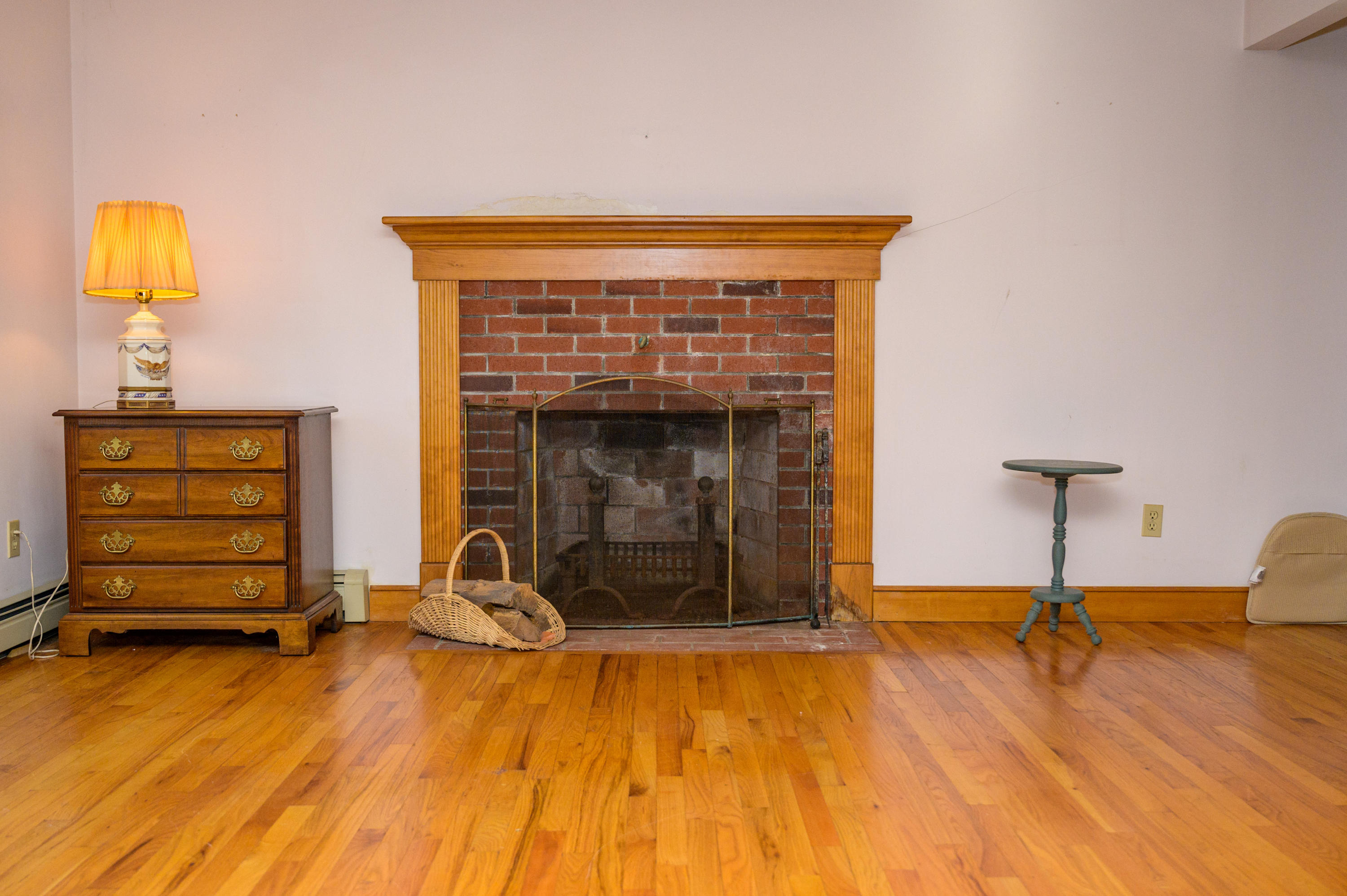 18 Warren Road Bourne, MA 02532 - Photo 10 of 36 a living room with furniture and a fireplace