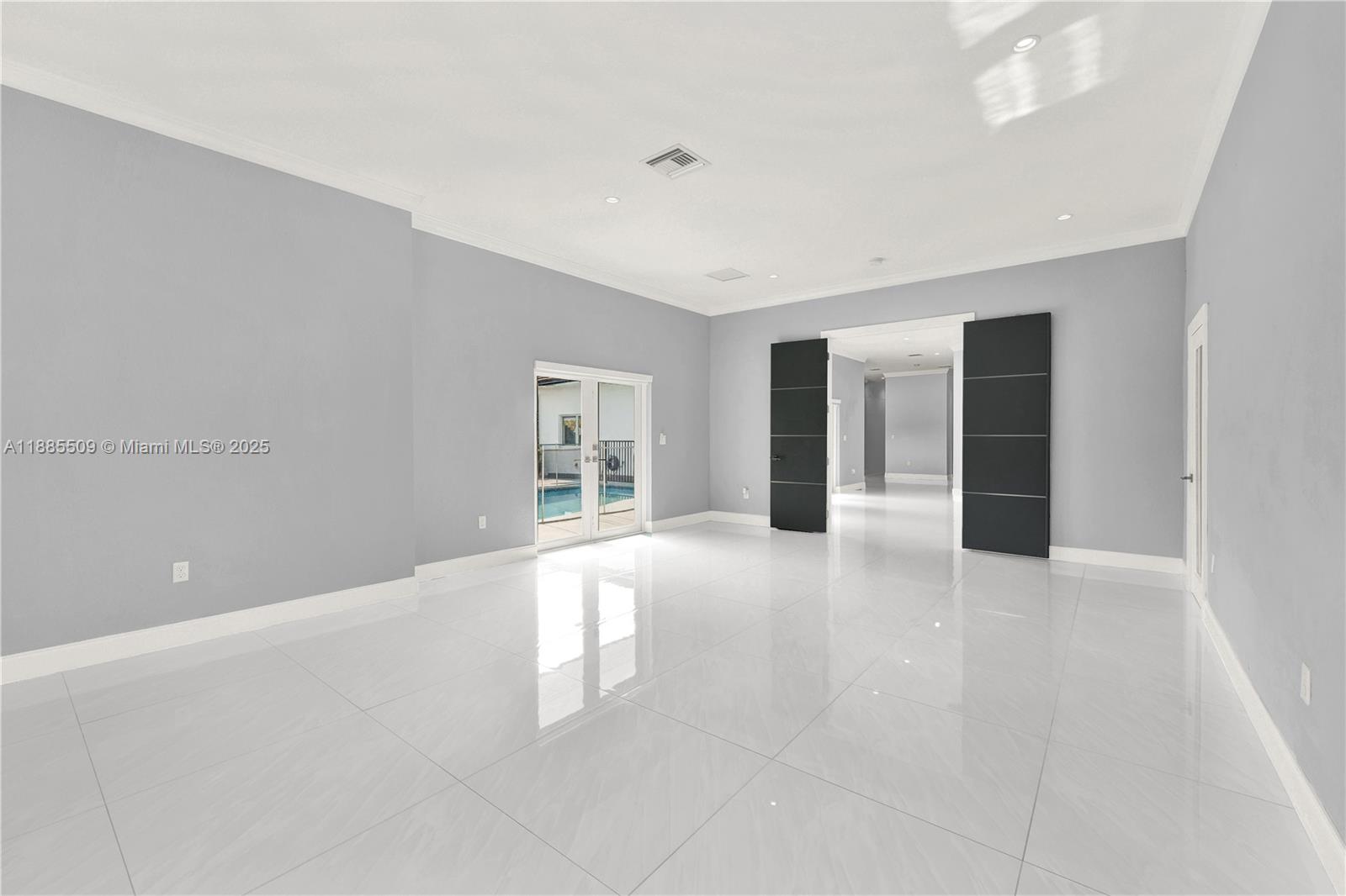 11921 Southwest 82nd Road Miami, FL 33156 - Photo 14 of 42 a view of an empty room with a window