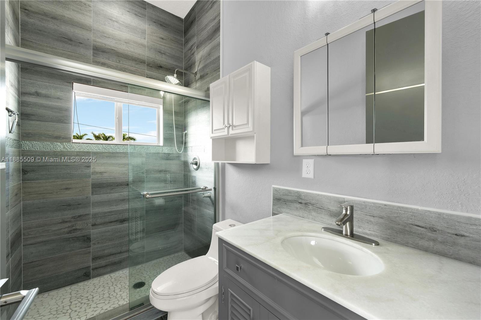 11921 Southwest 82nd Road Miami, FL 33156 - Photo 35 of 42 a bathroom with a sink toilet and shower