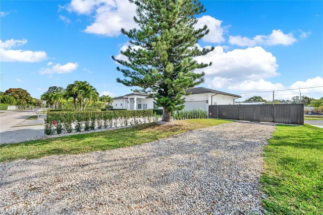 a view of a backyard with tree s
