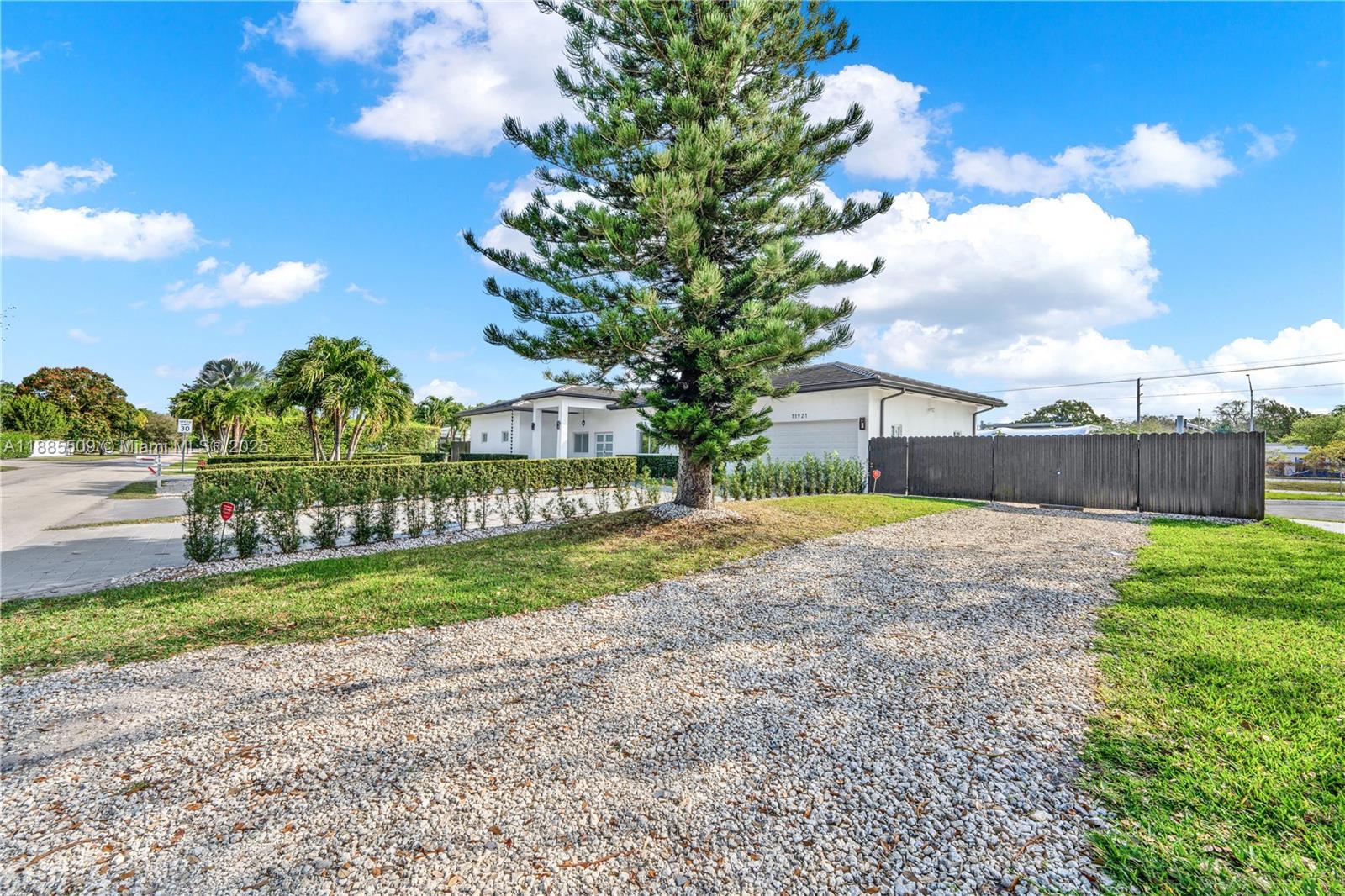 11921 Southwest 82nd Road Miami, FL 33156 - Photo 4 of 42 a view of a backyard with tree s