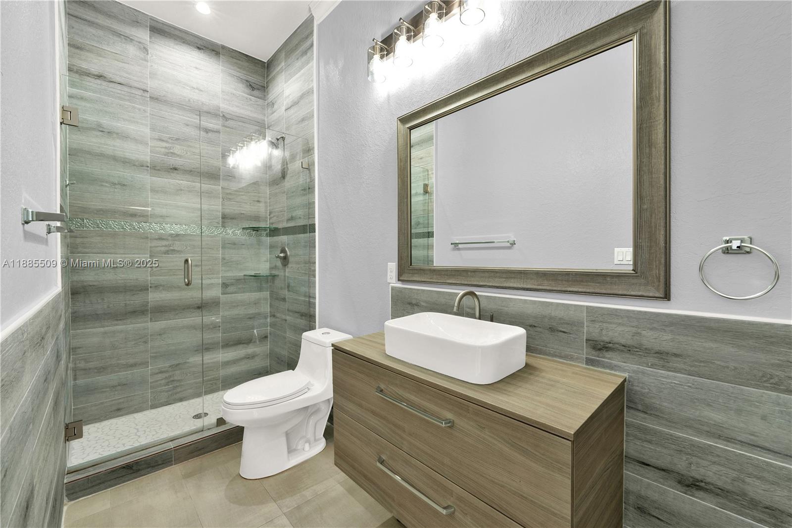 11921 Southwest 82nd Road Miami, FL 33156 - Photo 8 of 42 a bathroom with a sink a toilet and shower