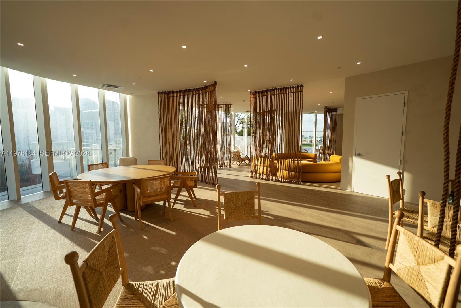 275 Southwest 6th Street, Unit 507 Miami, FL 33130 - Photo 15 of 19 a large room with lots of chairs and mirrors