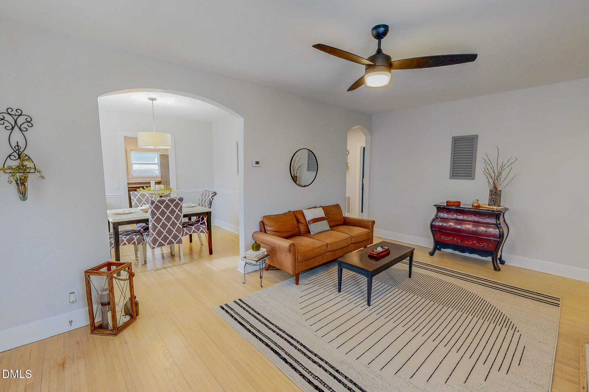 421 Gordon Street Roxboro, NC 27573 - Photo 11 of 40 a living room with furniture a rug and a ceiling fan
