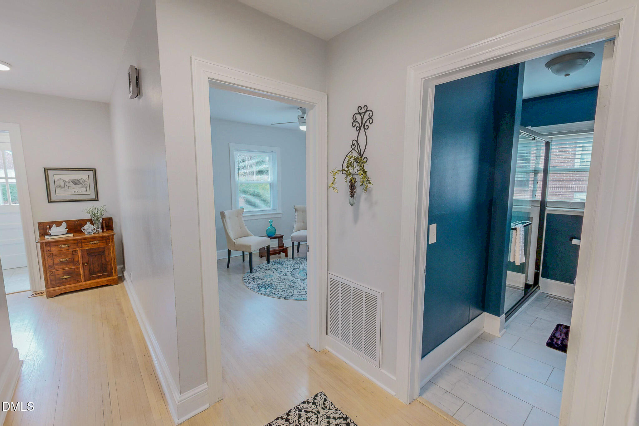 421 Gordon Street Roxboro, NC 27573 - Photo 20 of 40 a view of a hallway to a livingroom and a livingroom with furniture