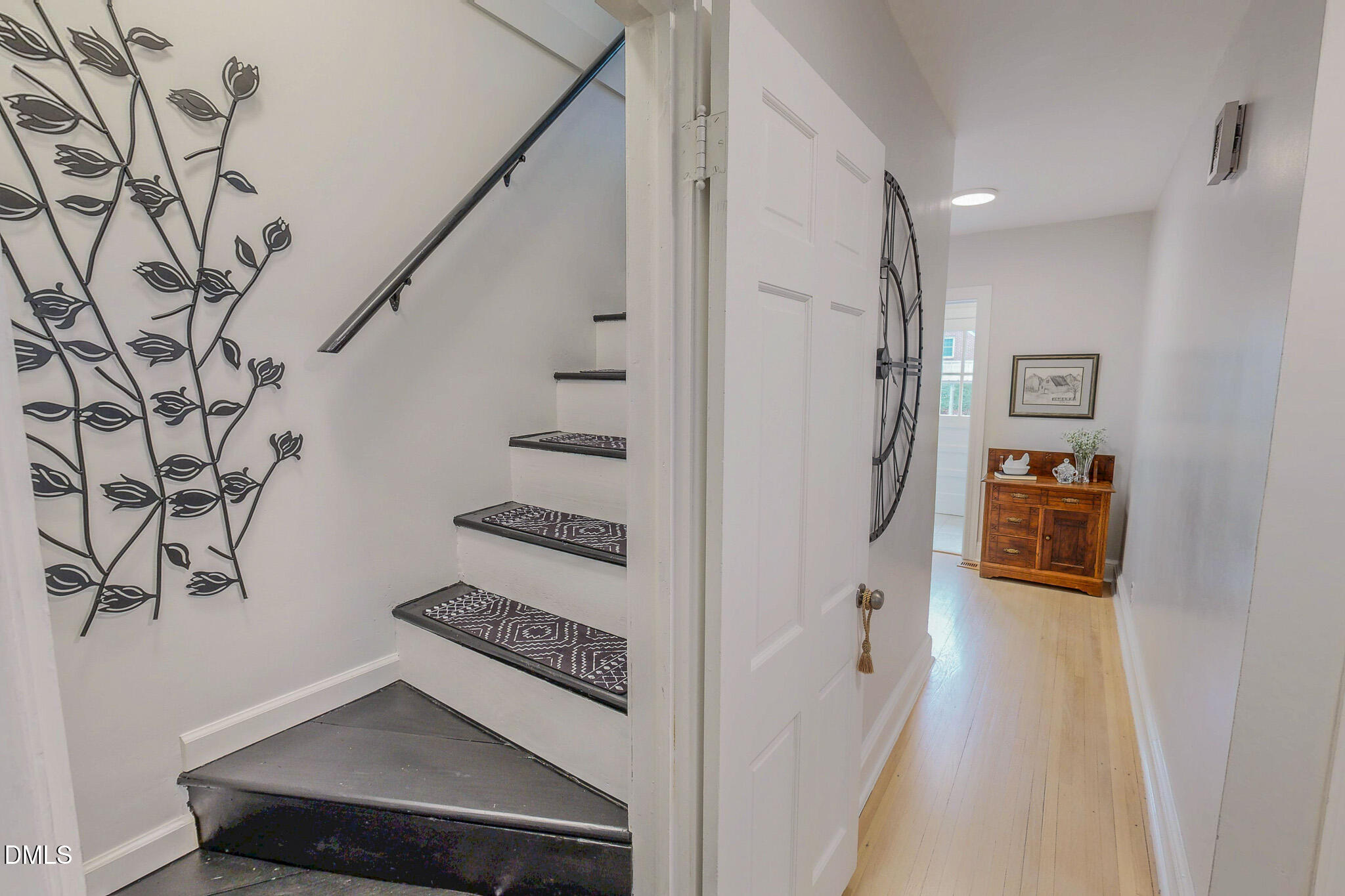 421 Gordon Street Roxboro, NC 27573 - Photo 29 of 40 a view of a hallway with wooden floor and staircase