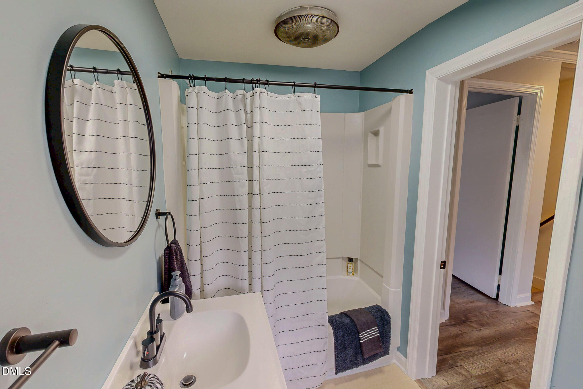 421 Gordon Street Roxboro, NC 27573 - Photo 34 of 40 a bathroom with a sink and a mirror