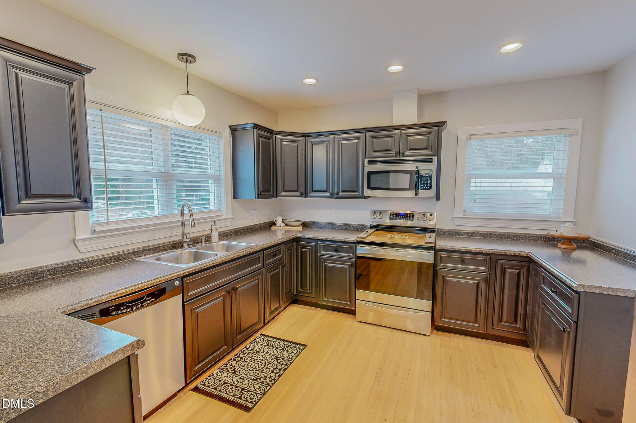 421 Gordon Street Roxboro, NC 27573 - Photo 4 of 40 a kitchen with stainless steel appliances granite countertop a sink stove and cabinets