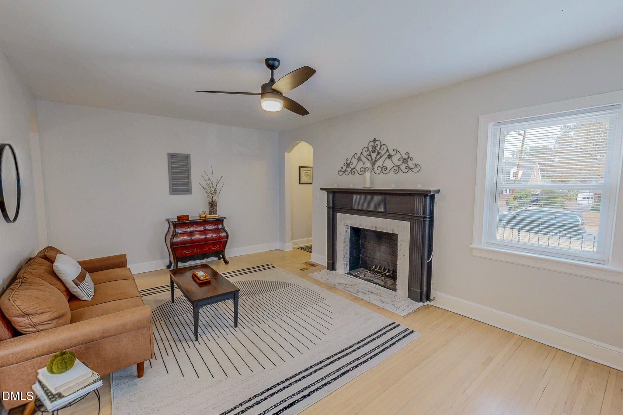 421 Gordon Street Roxboro, NC 27573 - Photo 10 of 40 a living room with furniture and a fireplace