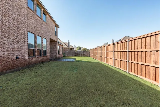 a view of backyard with deck