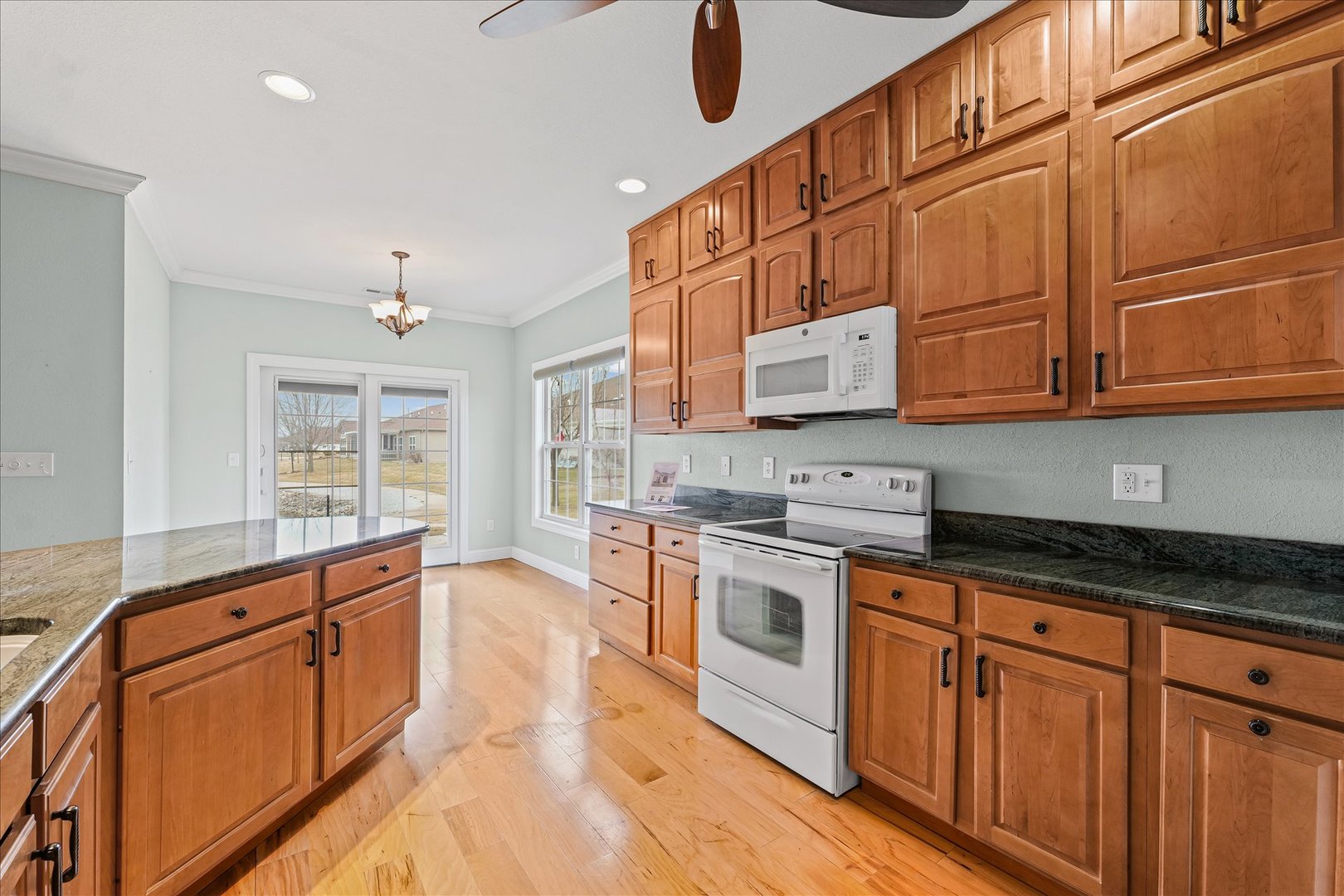 1908 S Prairie Urbana, IL 61802 - Photo 12 of 32 a kitchen with stainless steel appliances granite countertop a stove and a sink