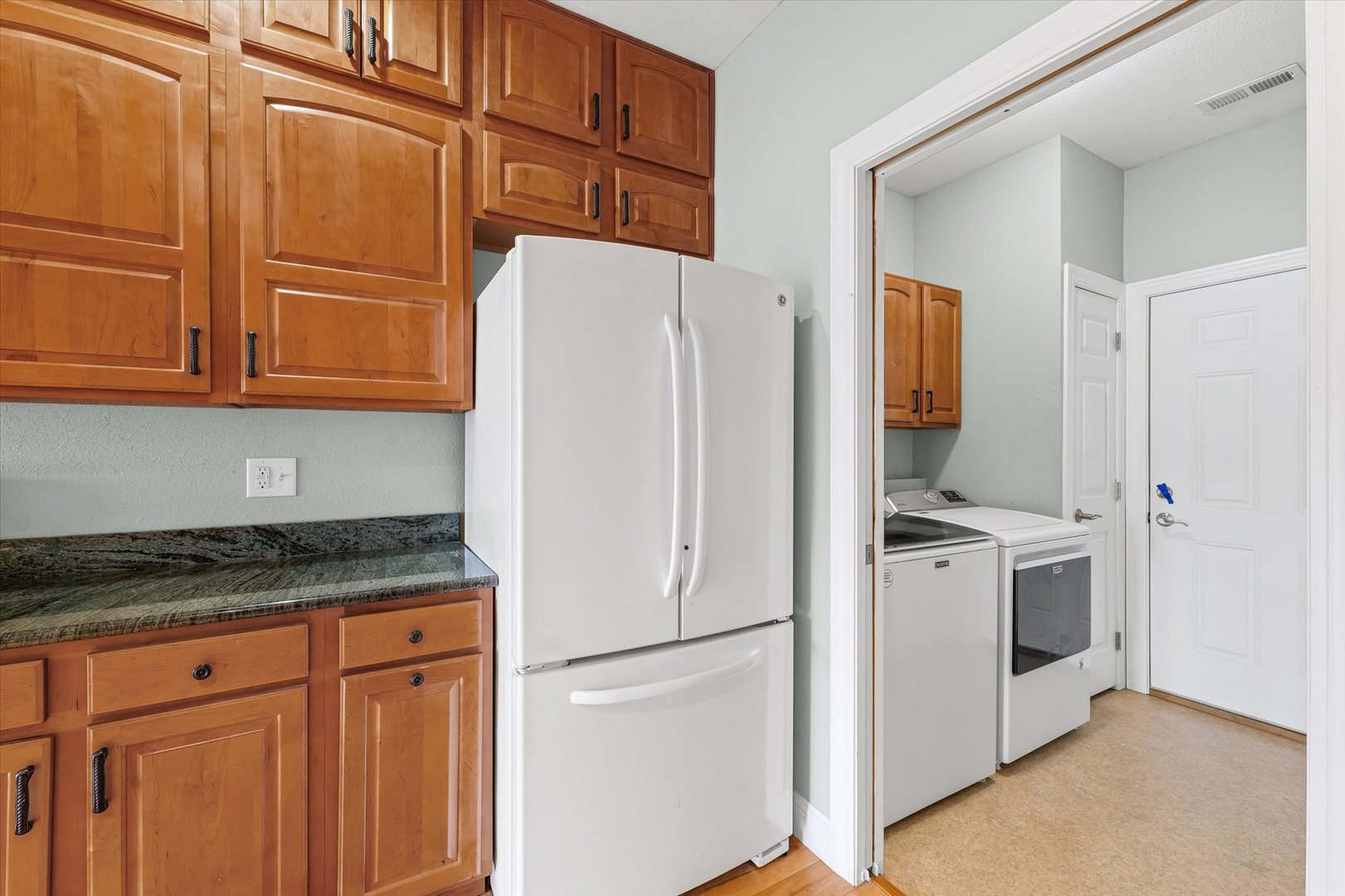 1908 S Prairie Urbana, IL 61802 - Photo 13 of 32 a white refrigerator freezer sitting inside of a kitchen