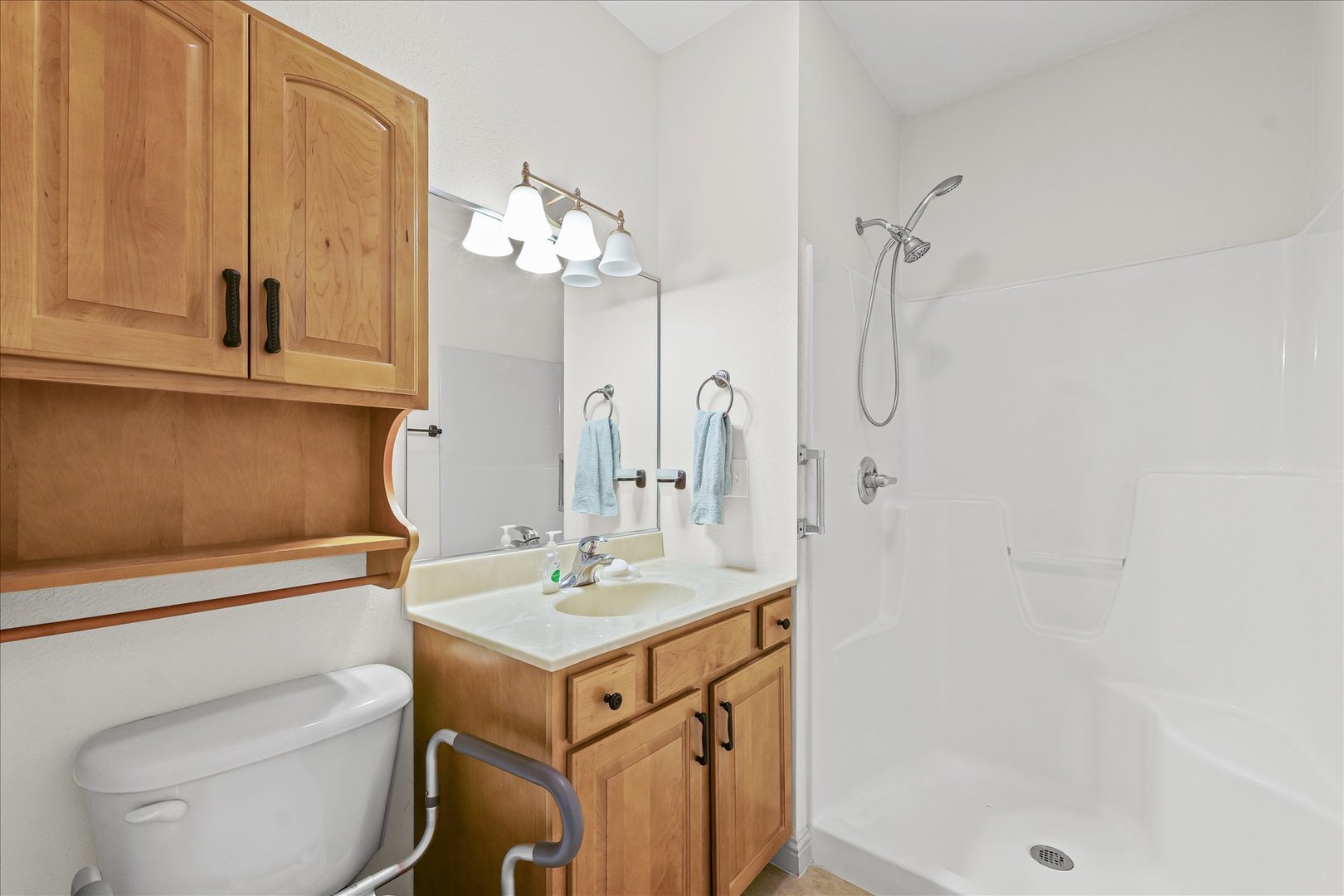 1908 S Prairie Urbana, IL 61802 - Photo 25 of 32 a bathroom with a sink a toilet and shower