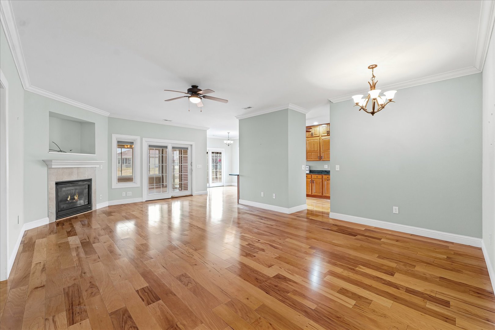 1908 S Prairie Urbana, IL 61802 - Photo 5 of 32 wooden floor in an empty room with a fireplace