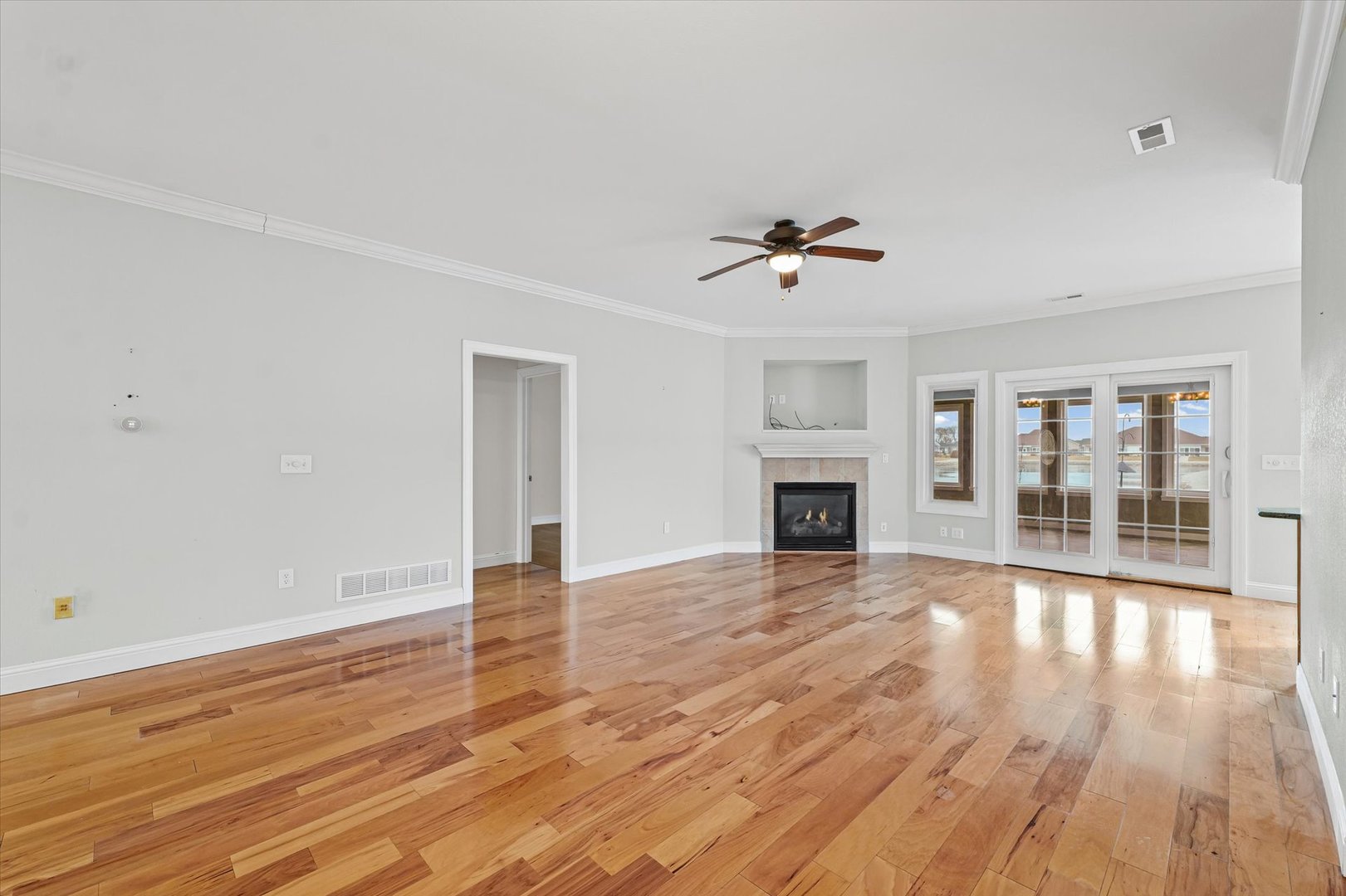 1908 S Prairie Urbana, IL 61802 - Photo 7 of 32 a view of an empty room with wooden floor and a fireplace